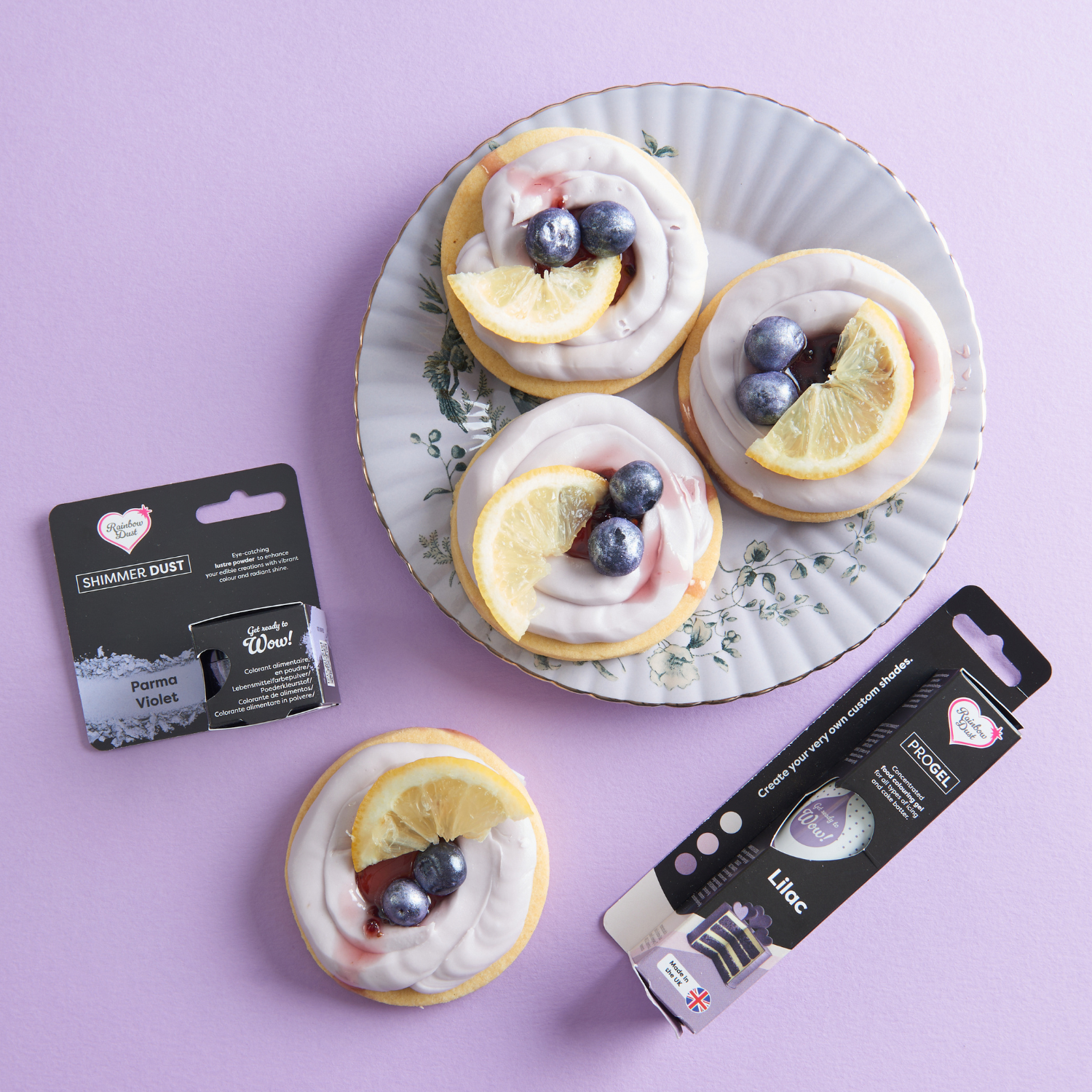 Lemon and blueberry iced biscuits displayed with edible pens and lustre dust